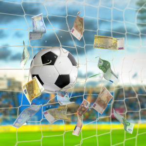 soccer ball in the net with euro banknotes