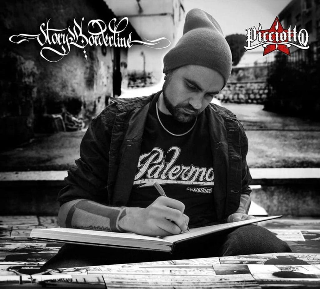 La copertina del progetto Storyborderline di Picciotto: il rapper scrive seduto in un quartiere difficile di Palermo